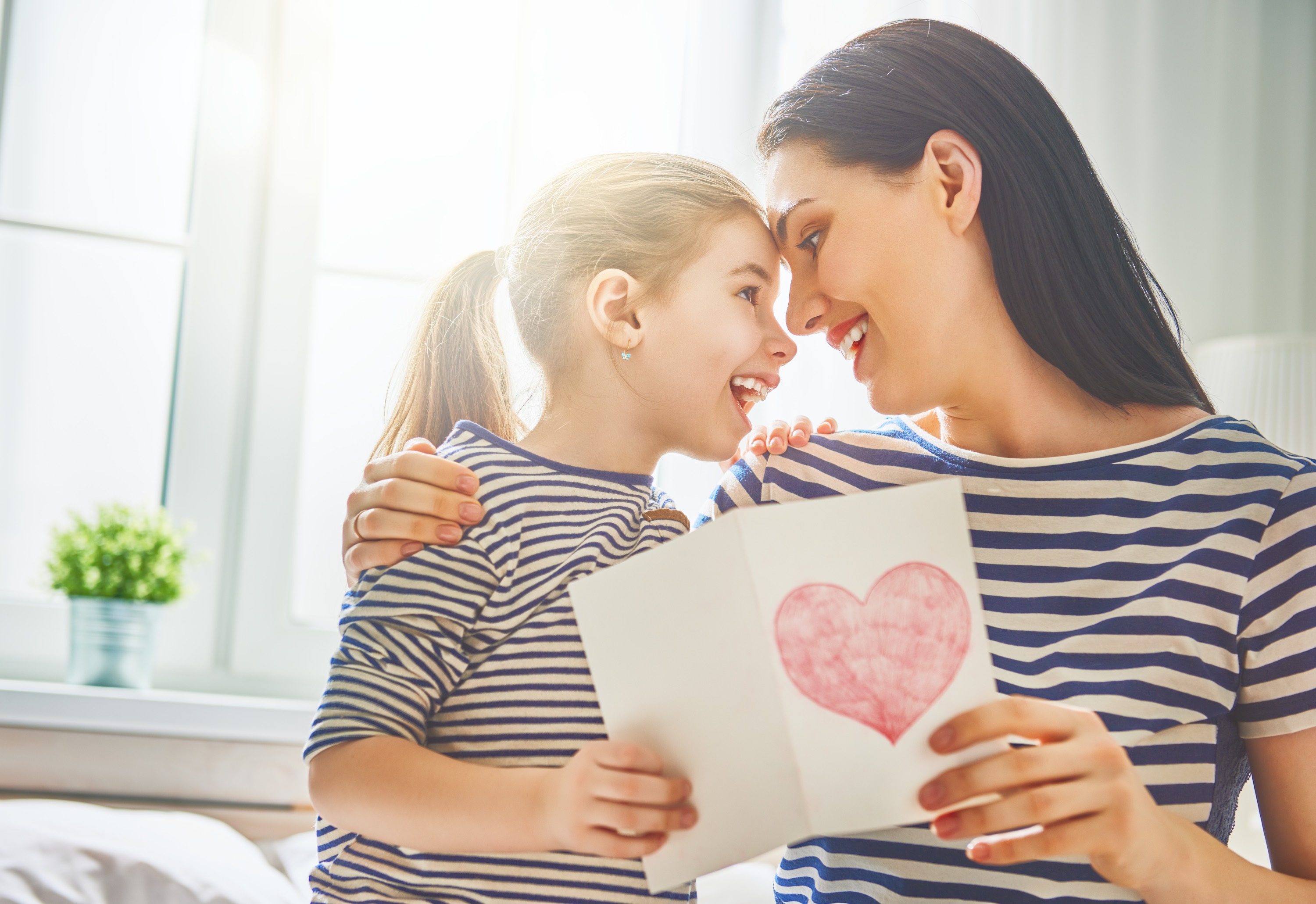 Mother and child with a heart drawing